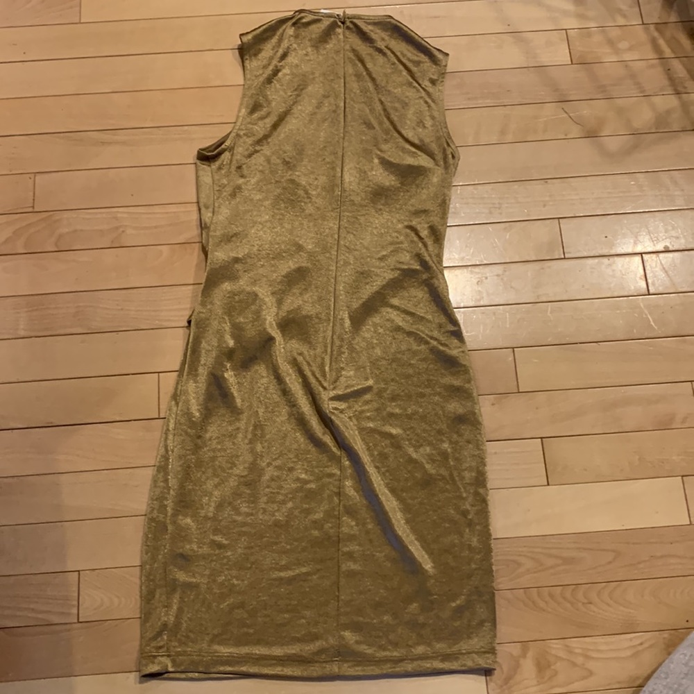 Brand new NWT beautiful gold mini dress with open neck and rushed across body